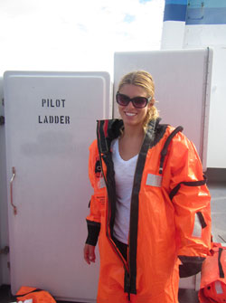 Carlie models her survival suit during man overboard drill.