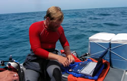 Derek Smith collects oceanographic data at Kure Atoll.