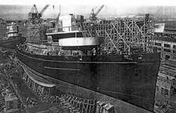 USS Macaw at slip 7, Moore Drydock Company, 12 July 1942.