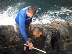 Intertidal Monitoring Team members brave the rocky shorelines to conduct surveys.