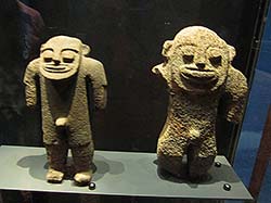 Stone figurines from Mokumanamana are on display at the Bishop Museum.