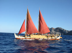 Hōkūleʻa sailing in front of Nihoa.