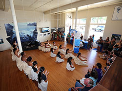 Ka ʻUmeke Kaʻeo Public Charter School students perform an opening ceremony at Mokupāpapaʻs Grand reopening.