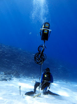 Researcher deploying acoustic recorder in PMNM.