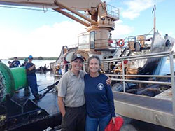 Midway Atoll Refuge Biologist Meg Duhr-Schultz sends off Kure Atoll Manager Cynthia Vanderlip and 28 Laysan ducks to Kure Atoll.  