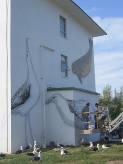 Wyland is seen working on one of his murals.