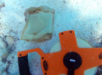 Glass from the cockpit canopy from a Brewster F2A-3 Buffalo wrecked at Midway Atoll in February of 1942.