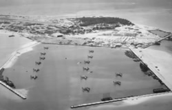 Planes of VP 13 and VP 102 in submarine basin at Sand Island, Midway Atoll, 29 January 1944.