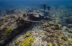 Dr. Kelly Gleason investigates an early 19th century anchor.