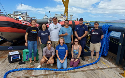 Group photo of researchers aboard ship.