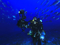 Rebreather diver Rob Whitton surrounded by jacks.