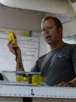 Bosun Group Leader Scotty Jones demonstrates a safety feature for the science divers.