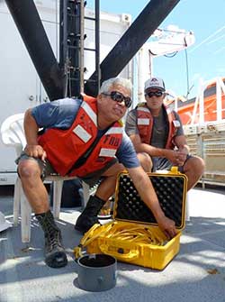 Seamen Surveyor Rich Hinostroza demonstrates the underwater diver recall system.